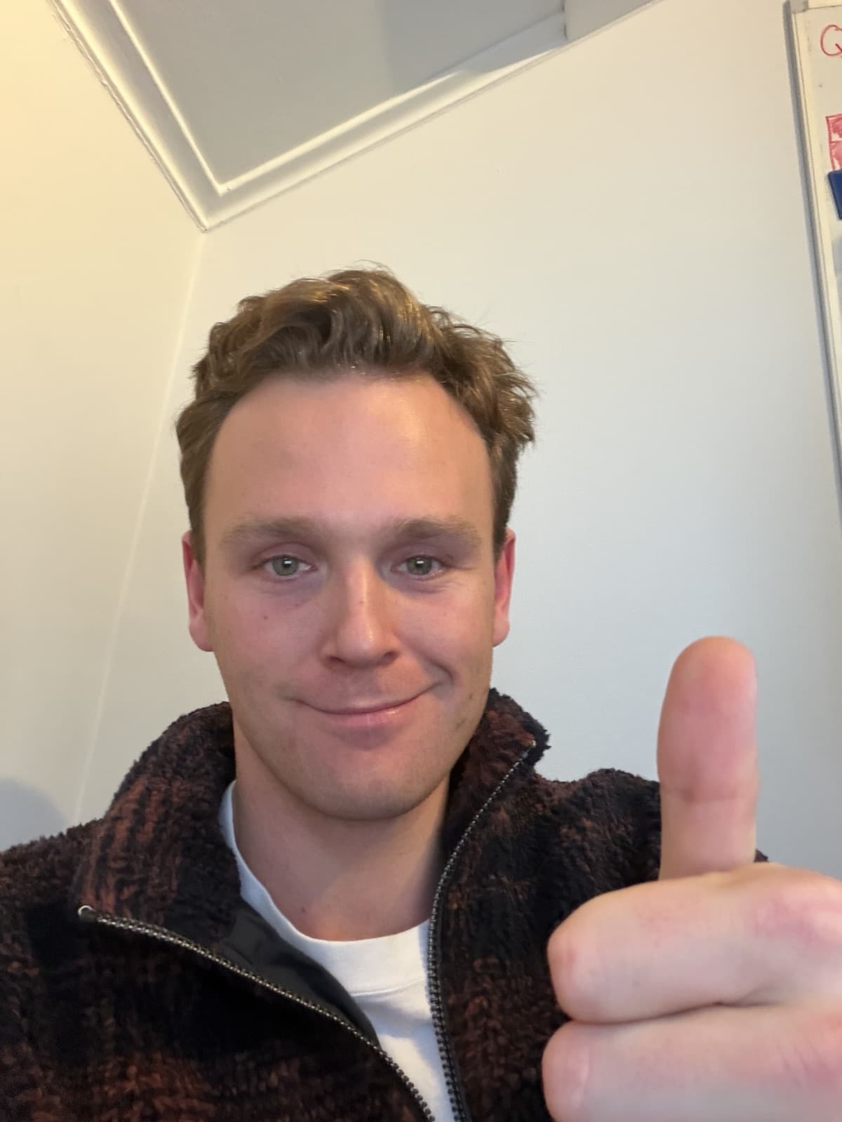 Victor giving a thumbs up